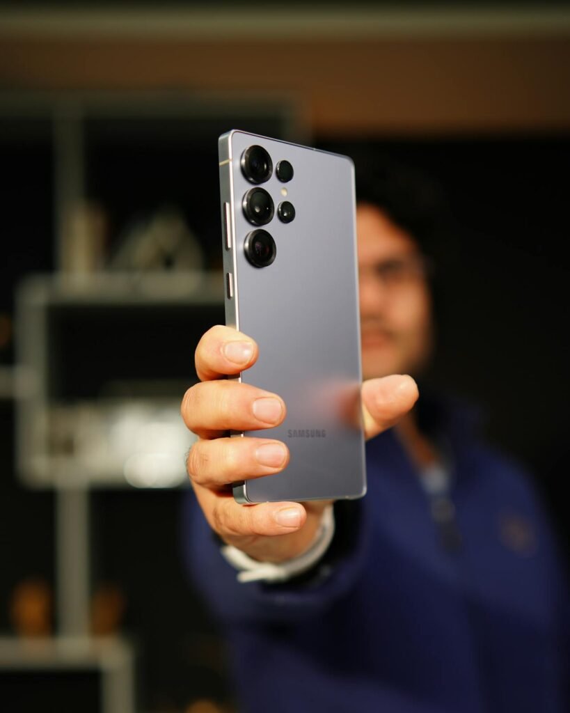 A man holding a Galaxy S24 with visible device back