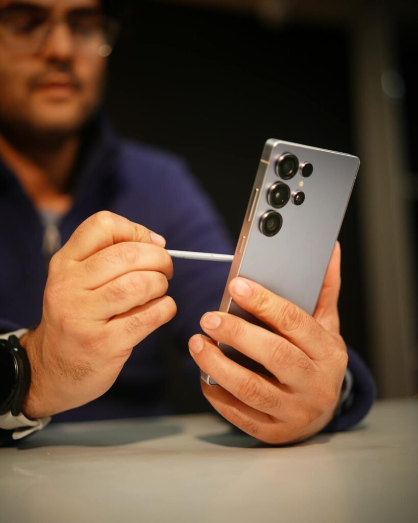 Man Using SPen on Galaxy S25 Ultra Indoors